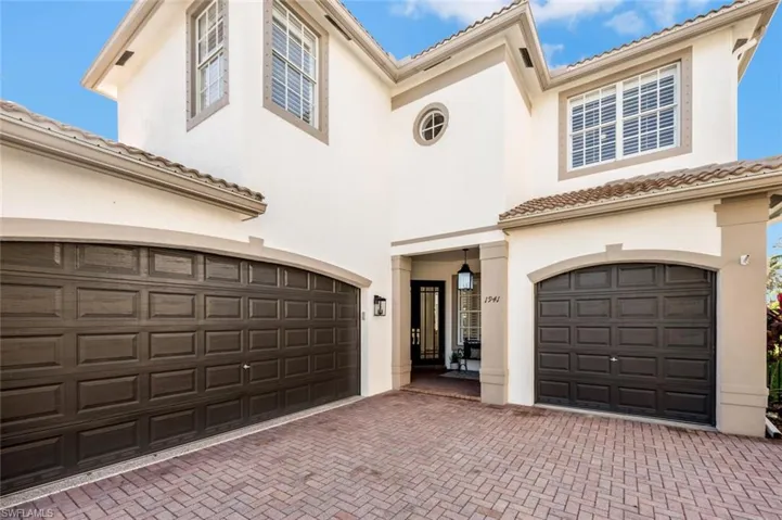 Mediterranean / spanish house with a 3 car garage