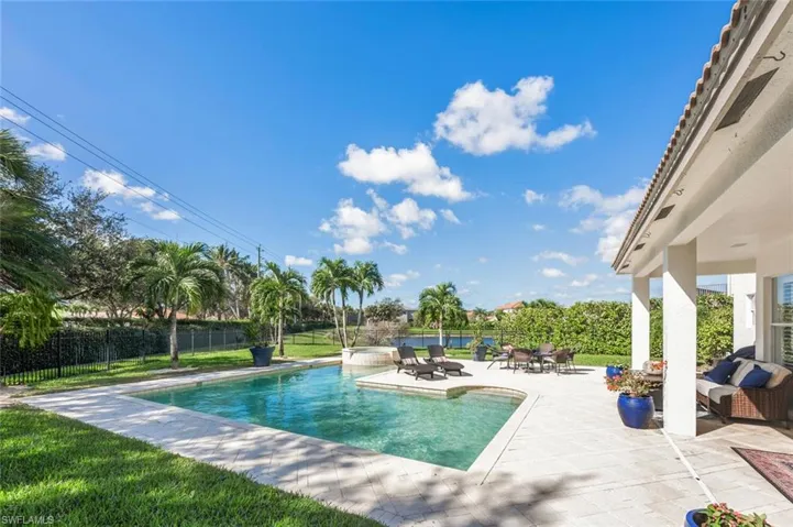 View of pool with a patio and a hot tub