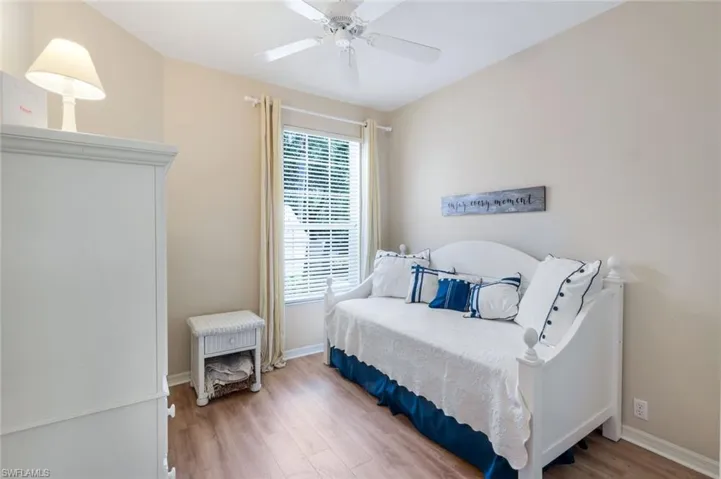 Bedroom featuring light wood-style flooring and ceiling fan