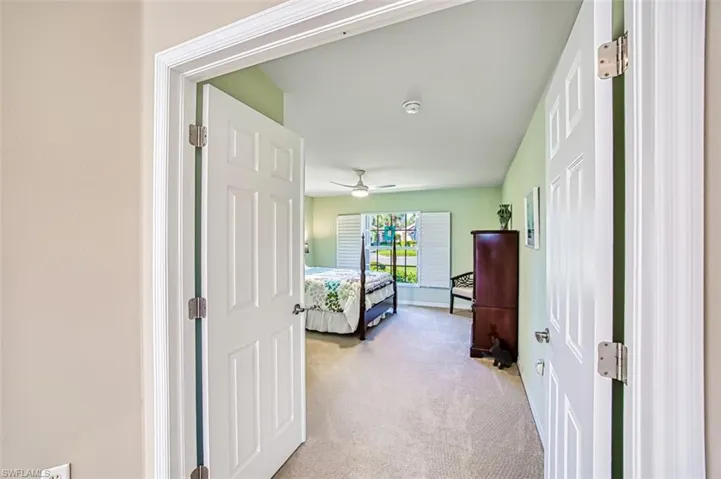 Bedroom with light carpet