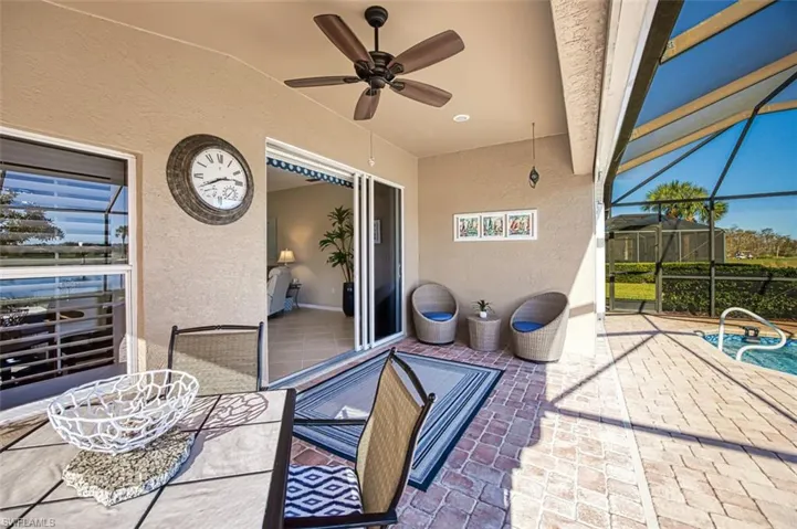 View of patio / terrace with ceiling fan and a lanai