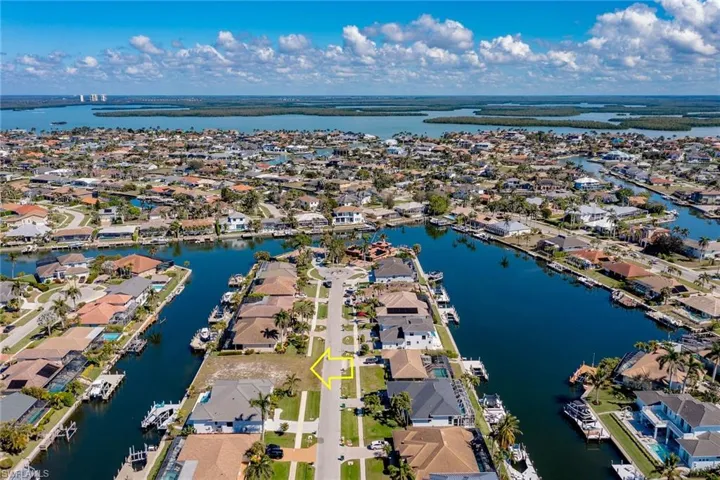 Drone / aerial view featuring a water view and a residential view