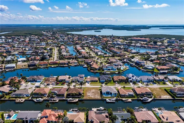 Drone / aerial view featuring a residential view and a water view
