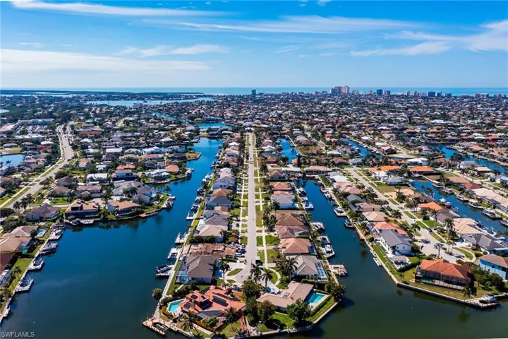 Drone / aerial view featuring a residential view and a water view