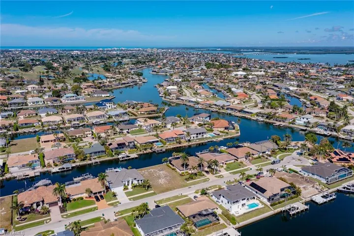 Aerial view featuring a water view and a residential view