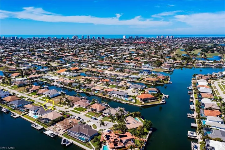 Birds eye view of property featuring a residential view and a water view