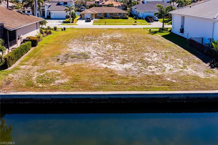 Drone / aerial view featuring a residential view and a water view