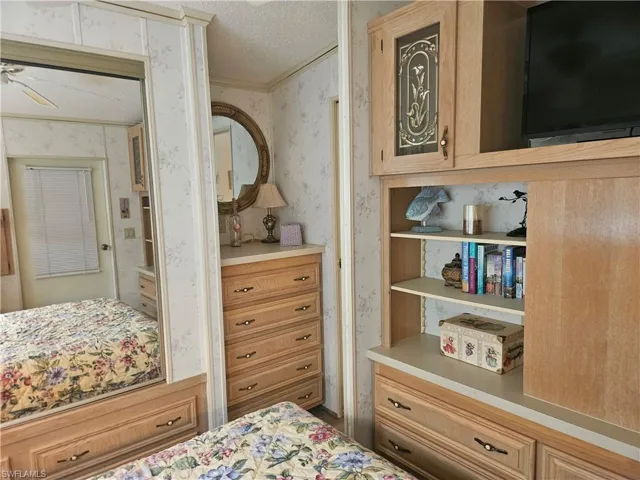 Bedroom with a textured ceiling