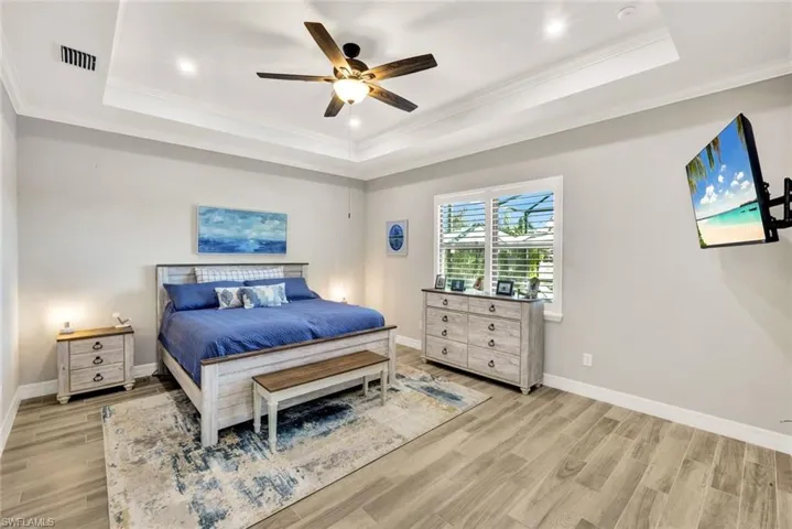 Large Master Suite with Neutral Colors and Crown Molding