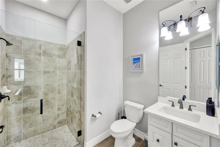 Full En Suite Secondary Bath with Glass Enclosed Shower