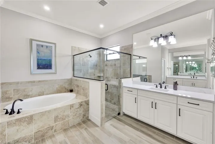 Master Bathroom with Quartz Counters and Separate Tub/Glass Enclosed Shower