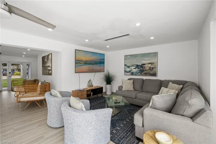 Neutral interior space featuring wood-finish flooring, recessed lighting, and a neutral wall color palette