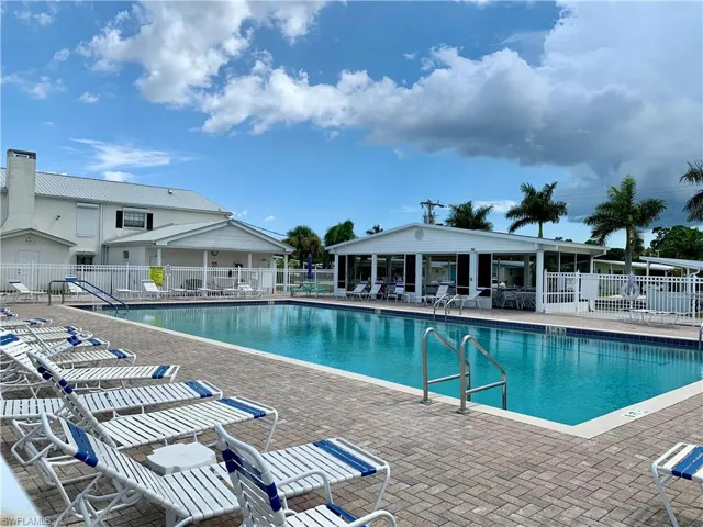 View of swimming pool featuring a covered patio