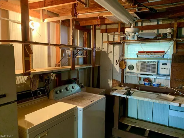 Workshop featuring separate washer and dryer, and sink