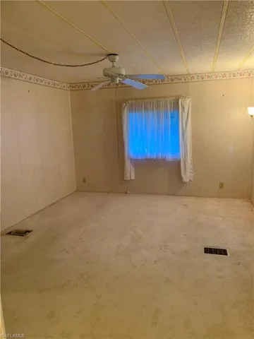 Unfurnished room with ceiling fan