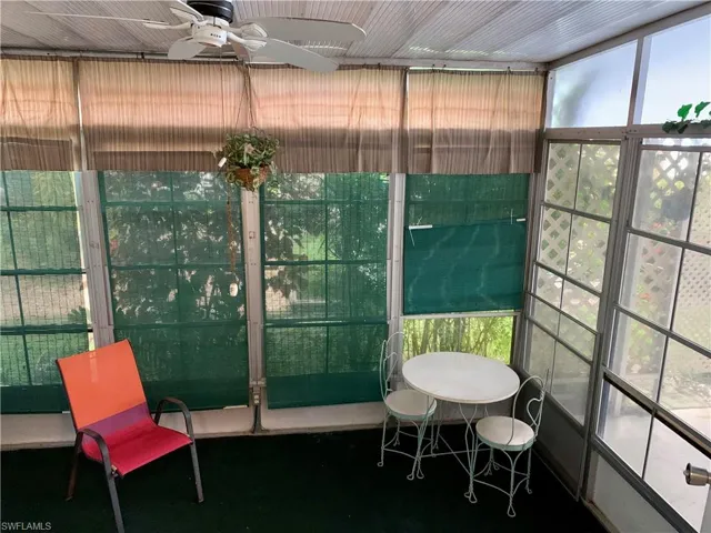 Sunroom featuring ceiling fan
