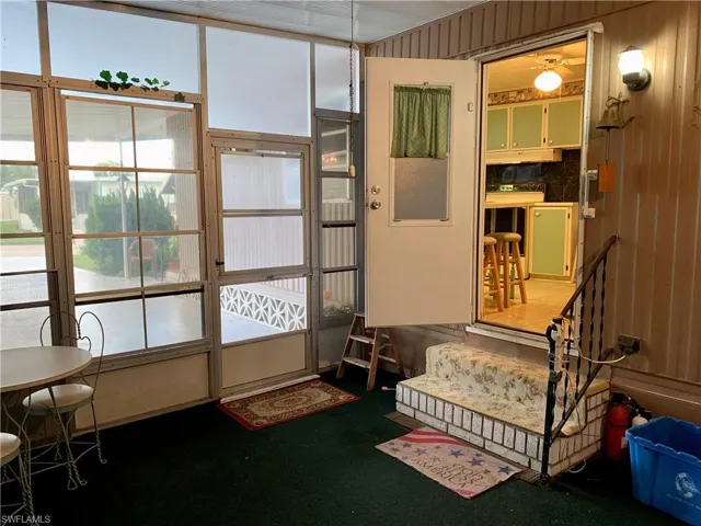 Sitting room with carpet floors and ceiling fan
