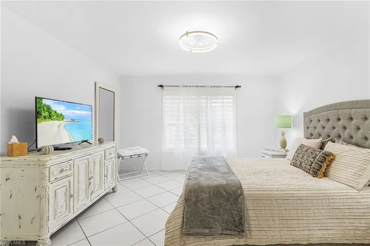 Bedroom featuring light tile patterned floors