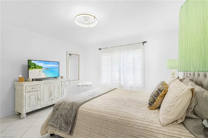 Bedroom featuring light tile patterned flooring