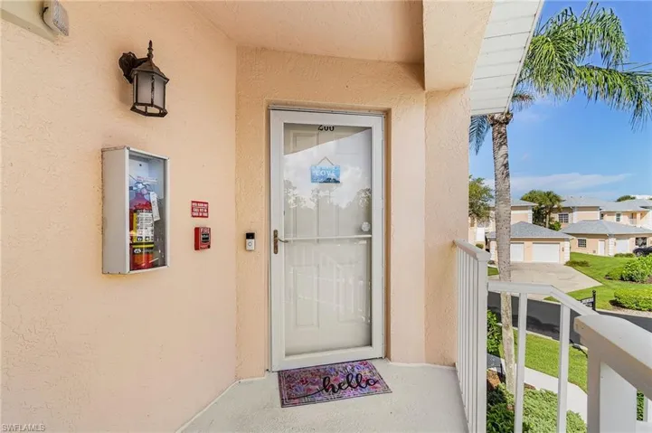 Property entrance with stucco siding