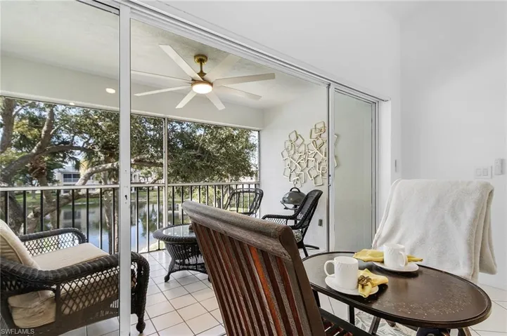 Sunroom / solarium with a water view