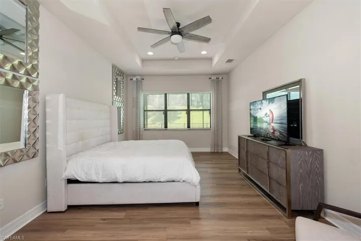 Laundry room with independent washer and dryer, cabinet space, and light tile patterned floors