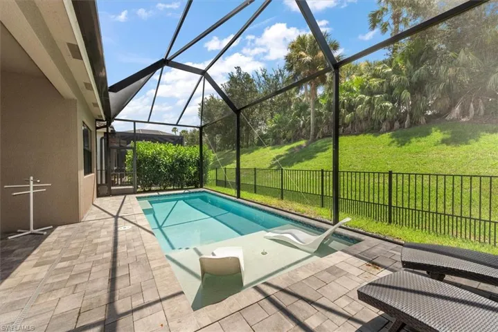 Community pool with a patio