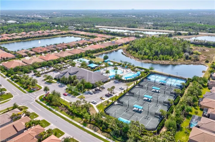 View of swimming pool featuring a patio, a fenced backyard, and a lanai