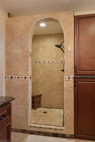 Bathroom with a tile shower and vanity