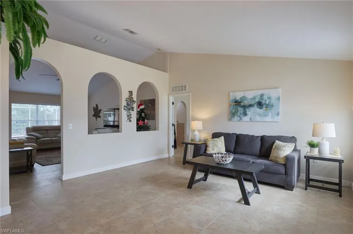 Living room with lofted ceiling