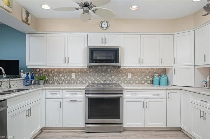 Plenty of beautiful functional quartz counterspace. Induction cook top