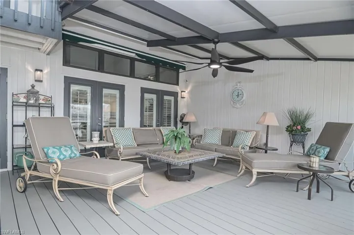 Lounge in comfort with ceiling fans, roof protection and screens