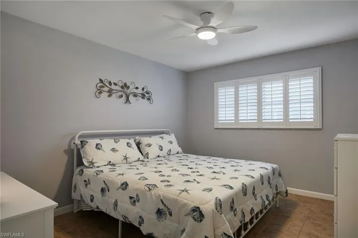 Bedroom with baseboards and ceiling fan
