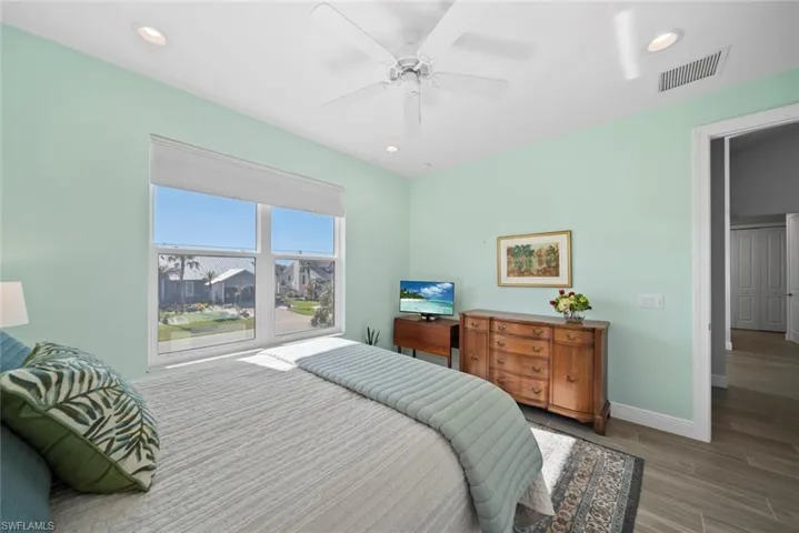 Bedroom featuring hardwood / wood-style floors and ceiling fan