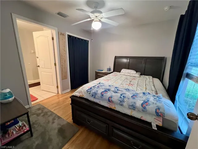 Bedroom featuring ceiling fan, light hardwood / wood-style flooring, and Jack and Jill bath