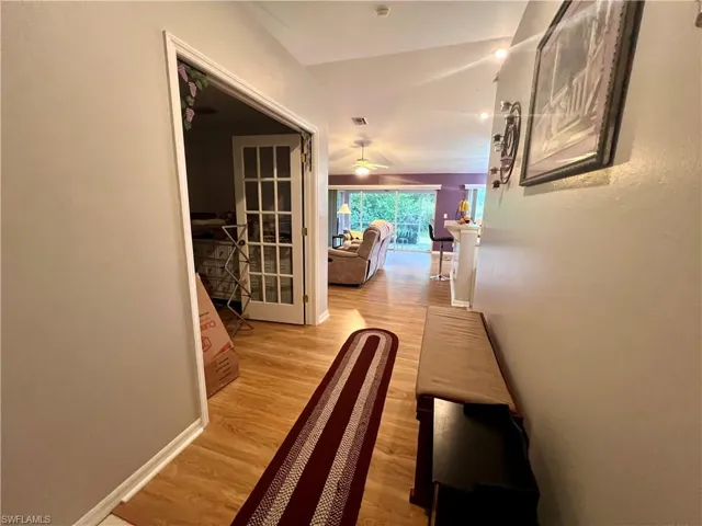 Entry foyer with French doors leading to the den