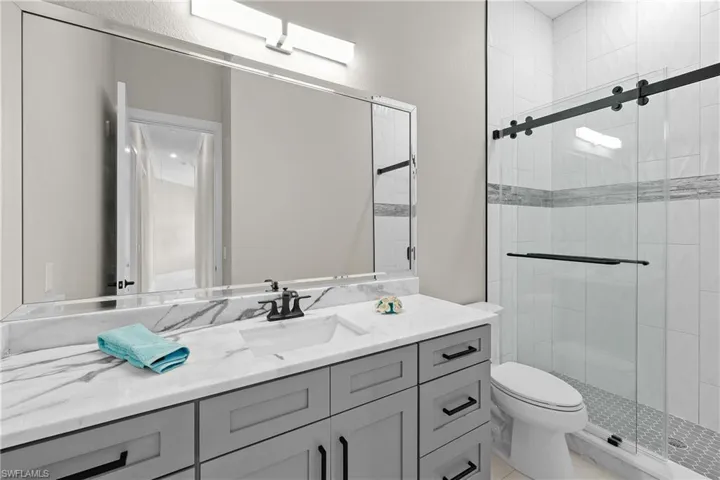 Guest bath 2 at end of hallway, servicing guest bedroom 2 and 3