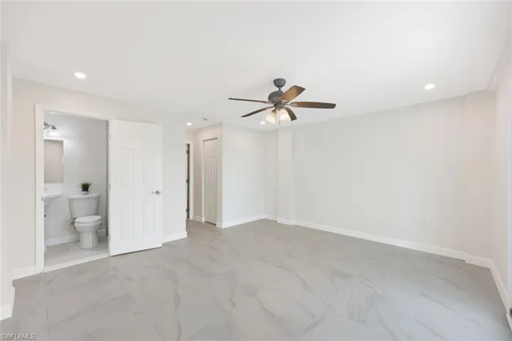 Guest Bedroom on Garage Floor with En-Suite Bathroom and Private Screened in Lanai with Door Leading to your Backyard Oasis!