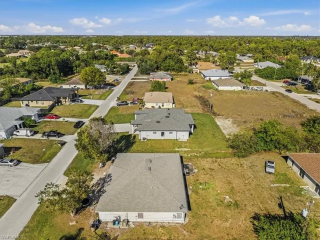 Aerial overview of property's location featuring nearby suburban area