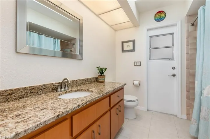 Second bathroom has a shower/tub combo and doubles as a pool bath.