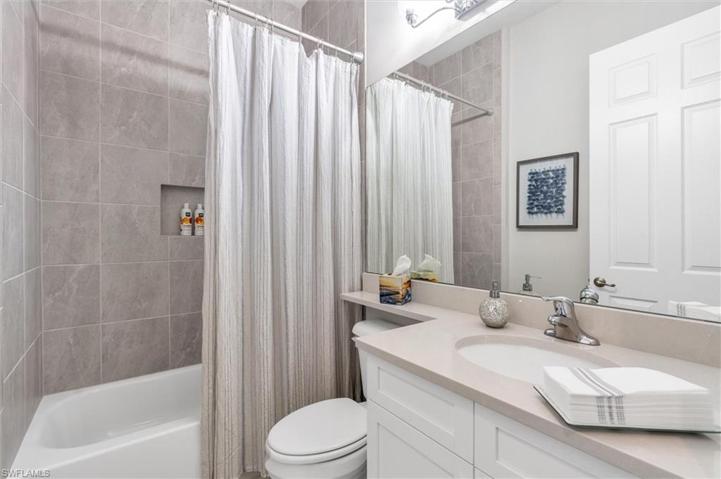 2ND Full Bathroom with Tub. Tile to the ceiling.
