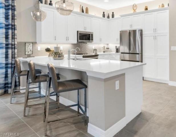 Soft Close cabinets, Quartz Counter top, Pantry and Upgraded Appliances, reverse osmosis drinking water.
