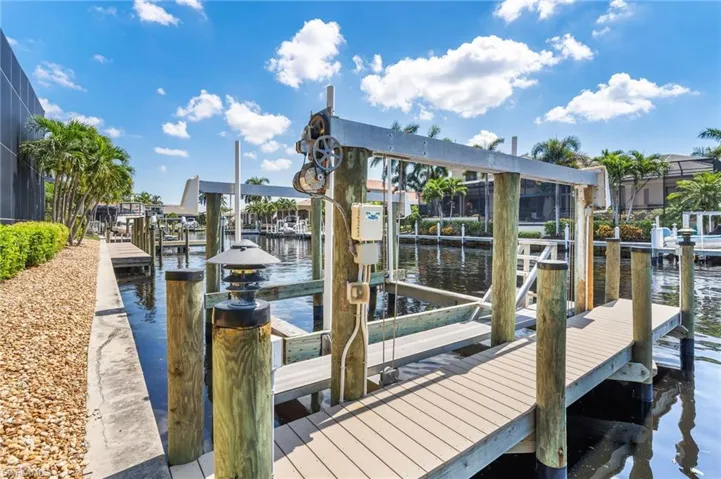 Dock area featuring a water view