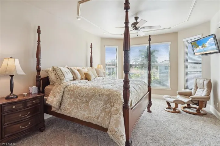 Bedroom featuring ceiling fan and light carpet
