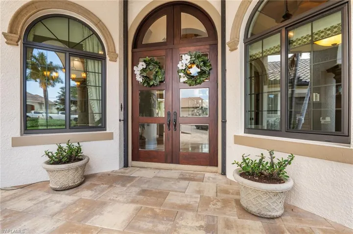 View of exterior entry featuring french doors