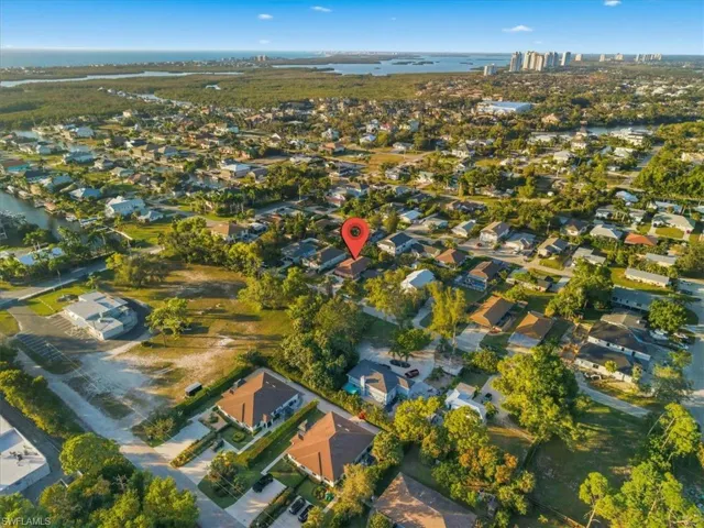 View of property location with nearby suburban area and a nearby body of water