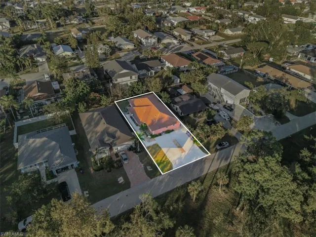 Aerial view of property's location featuring nearby suburban area and property boundaries highlighted