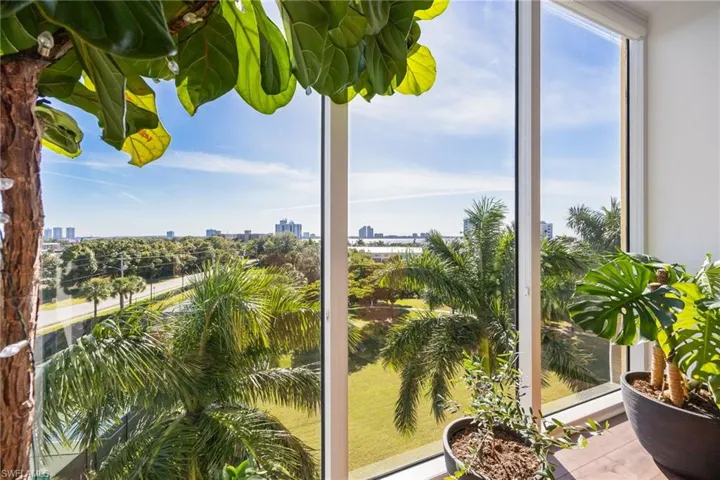 Sunroom / solarium featuring a view of city and healthy amount of natural light