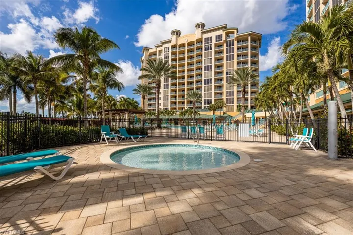 View of pool with a pool, a patio, and a community hot tub