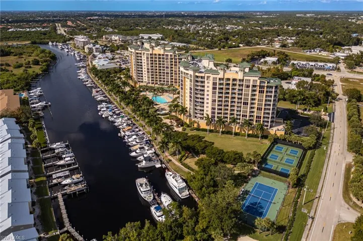 Aerial view of property's location featuring a large body of water